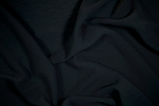 Schwarzer Stoff für Business- und Abendmode

