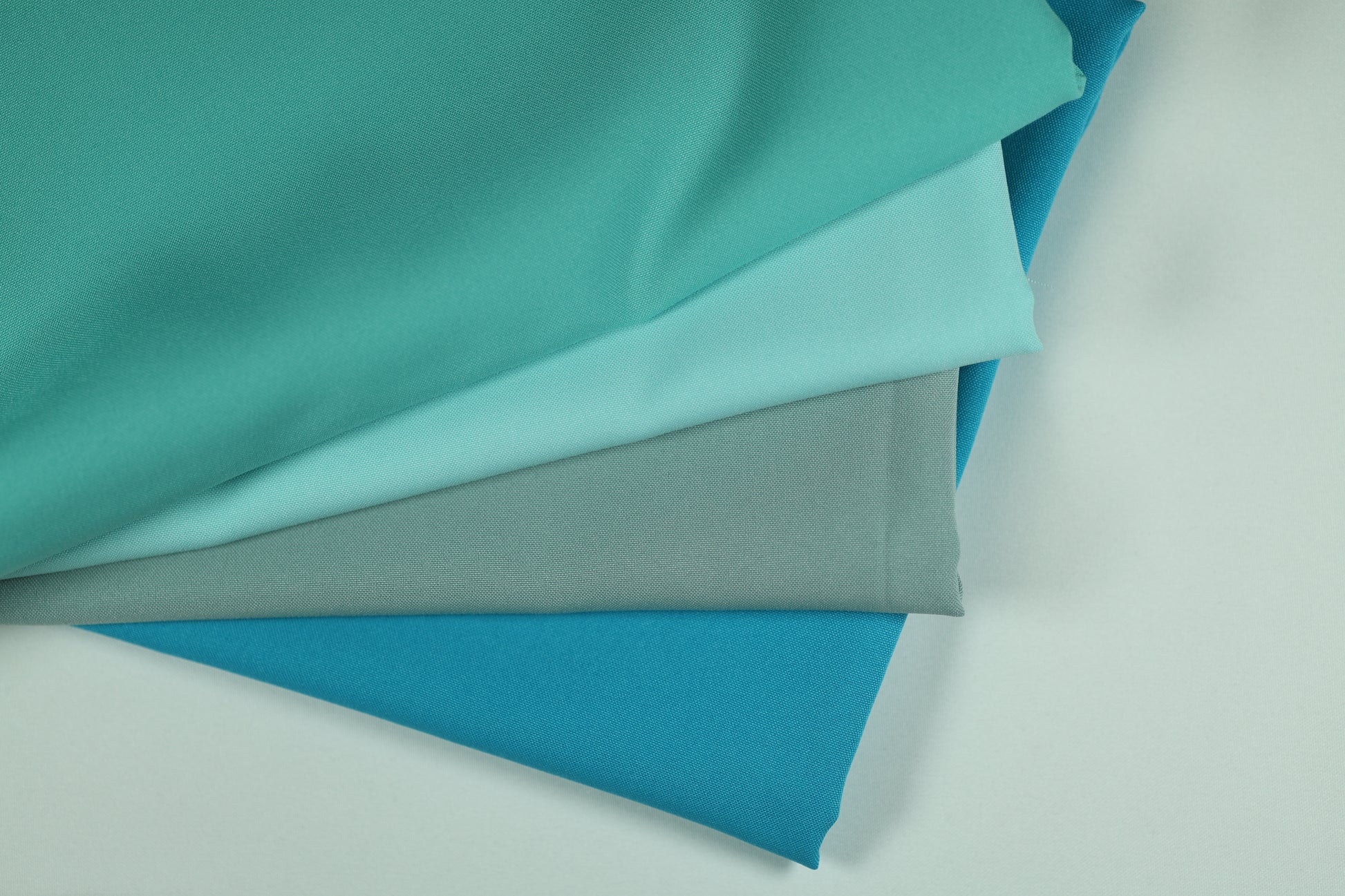 Polyester Panama Stoffe in Türkis-, Mint- und Aquatönen – harmonische Farbpalette für kreative Deko- und Nähprojekte